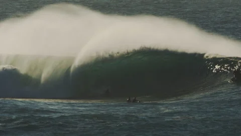 Mid barrel view of surfer in evening light mist Stock Footage 311431631