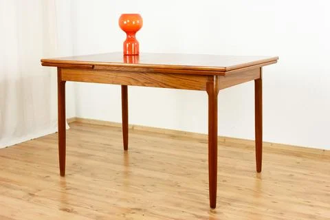 A mid century teak dining table with four chairs from the 50s 60s Danish De.. Stock Photos