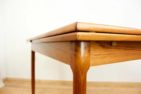 A mid century teak dining table with four chairs from the 50s 60s Danish De.. Stock Photos