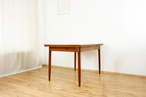 A mid century teak dining table with four chairs from the 50s 60s Danish De.. Stock Photos