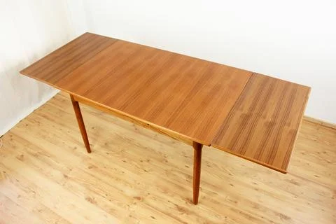 A mid century teak dining table with four chairs from the 50s 60s Danish De.. Stock Photos