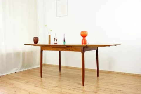 A mid century teak dining table with four chairs from the 50s 60s Danish De.. Stock Photos