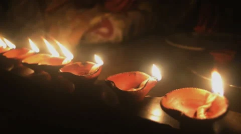 Mid close shot of earthen lighted lamps in Deepawali.India. Stock-Footage 43098693