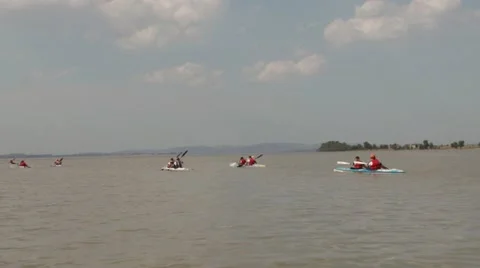 Mid-day canoeing in the dam Stock Footage 12264843