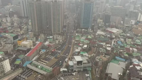 Mid-day over a downtown skyscraper around Seoul International Financial Center Stock Footage 240749189