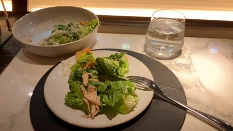 Mid Hand Held Shot Of Caesar Salad At A Restaurant Stock-Footage 219694622
