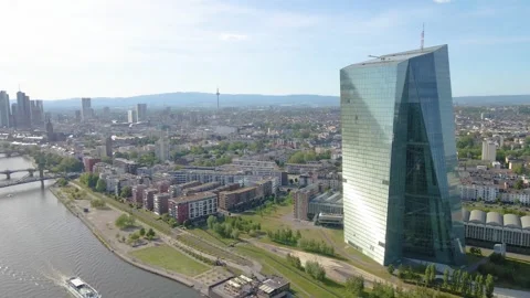 Mid height orbit around ECB with city opening behind Stock Footage 331874554