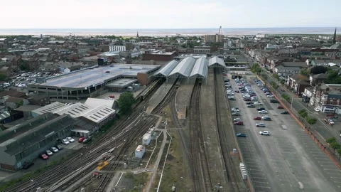 Mid-level aerial fly up clip of the train and railway station Stock Footage 244813488