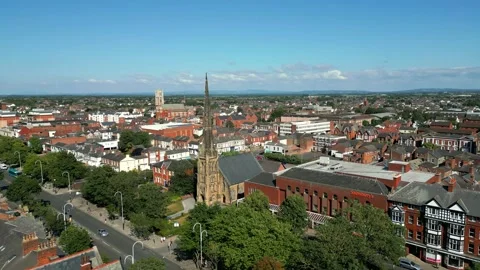 Mid-level aerial fly by clip of St George's URC Church with tall spire Stock Footage 244814008