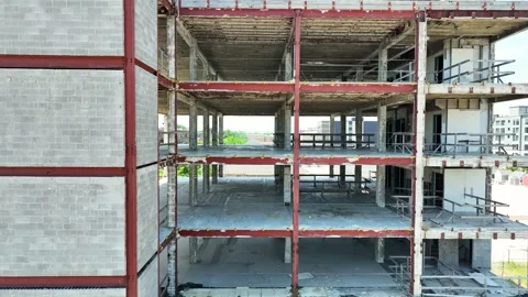 Mid level aerial tilt to level showing the engineering of the building. Stock Footage 279811884