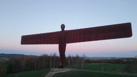A mid-level drone orbit circling the iconic Angel of the North Stock Footage 327195686