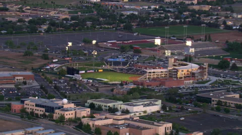 Mid-level flight past baseball stadium, home of Albuquerque Isotopes. Shot in Stock Footage 59538647