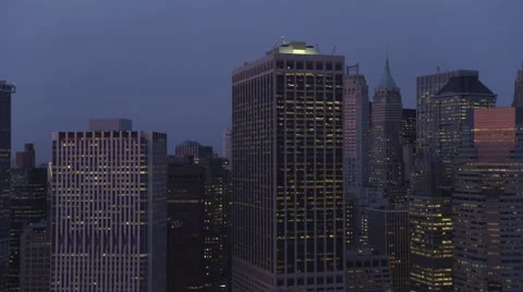 Mid-level flight past the skyscrapers of Lower Manhattan at dusk. Shot in 2011. Stock Footage 59170322