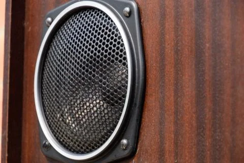 Mid range speaker with a protective grid on the speaker. Stock Photos