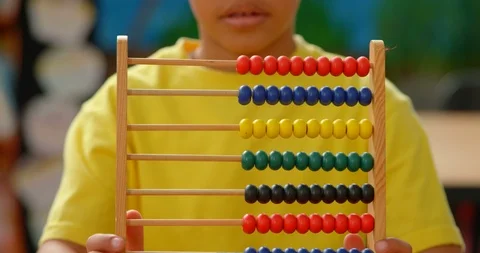 Mid section of African American schoolboy using abacus in classroom at school 4k Stock Footage 106942009