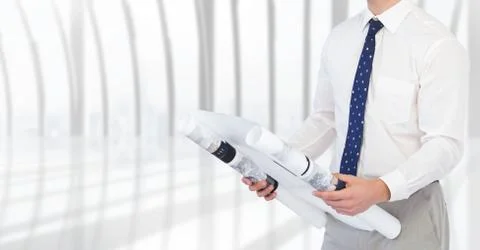 Mid-section of architect holding blue print Foto stock