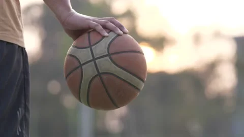 Mid section of basketball player holding basketball in basketball court. Stock Footage 166931950