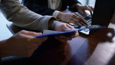 Mid section of business people working together at desk in office Stock Footage 75451262