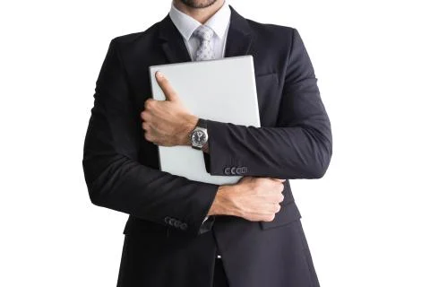 Mid section of businessman holding computer Fotos de archivo