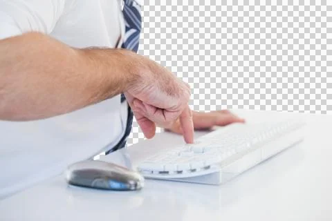 Mid section of businessman using computer keyboard Fotos de archivo