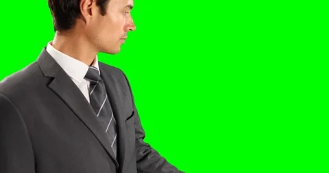 Mid section of Caucasian man holding his hand for copy space with green screen Stock Footage 127057598