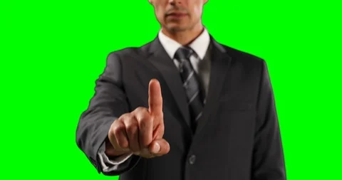 Mid section of a Caucasian man touching the screen with green screen Stock Footage 127057586
