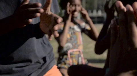 Mid section of children playing clapping game Stock Footage 61292495