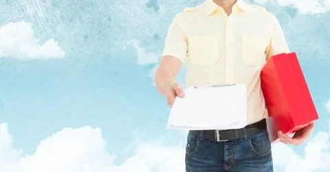 Mid section of delivery man holding clipboard and parcel box 写真素材
