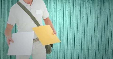 Mid section of delivery man holding courier Stock Photos