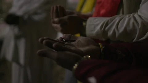 Mid section of devotees praying in the temple, Varanasi Stock-Footage 104432213