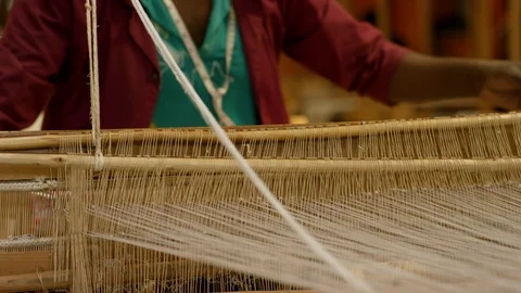 Mid section of female weaver working in a handloom Stock Footage 107018061