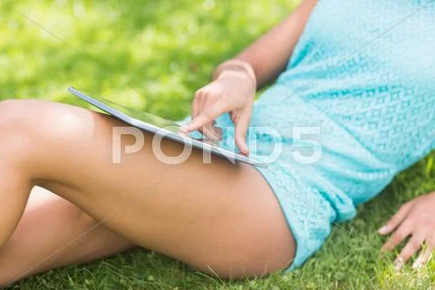 Mid section of gorgeous model using tablet Stock Photos