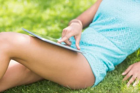 Mid section of gorgeous model using tablet Stock Photos