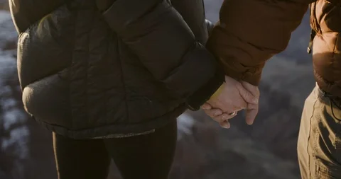 Mid section of hiker couple holding hands, close-up Stock Footage 145282039