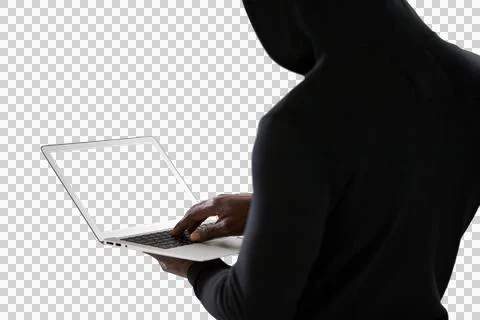 Mid section of male hacker using laptop Stock Photos