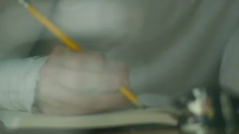 Mid-section of man drawing sketch in book Stock Footage 107028323