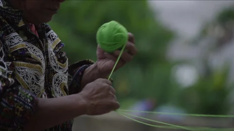 Mid section of man making a ball of wool, Guatemala Stock Footage 63059357
