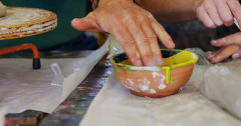 Molding clay on the wheel