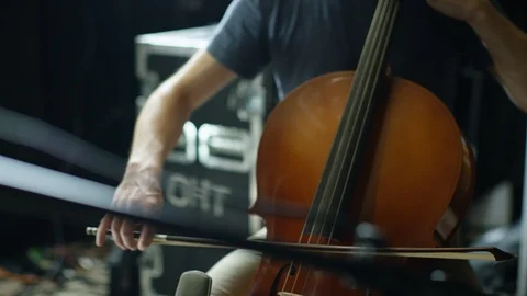 Mid section of man playing a cello Stock Footage 108934819
