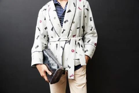 Mid section of man in short dressing gown holding sponge bag Stock Photos
