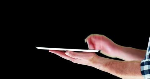 Mid section of man using digital tablet Stock Footage
