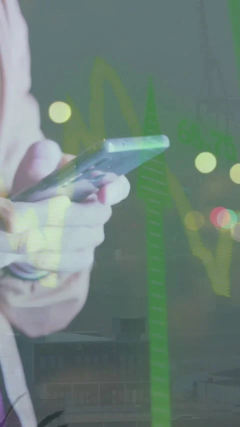 Mid section of man using smartphone against spots of light Stock Footage 344613955