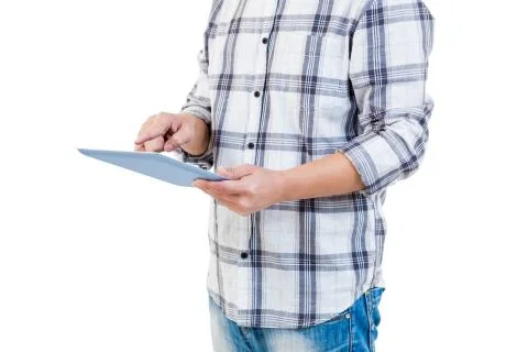 Mid section of man using tablet computer Fotos de archivo