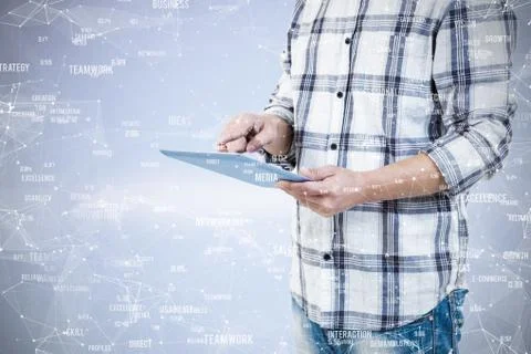 Mid section of man using tablet computer against sphere of skills Fotos de archivo