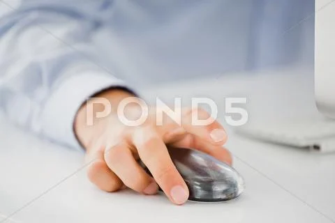 Mid-Section Of Mans Hand Working On Computer