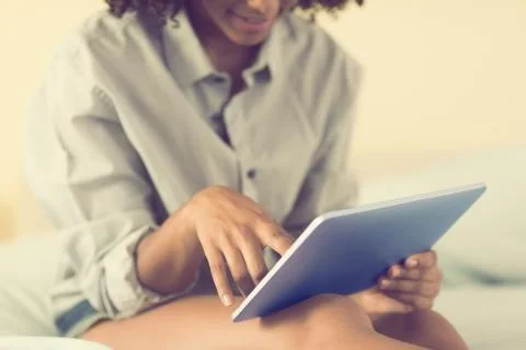 Mid section of pretty model using tablet Stock Photos