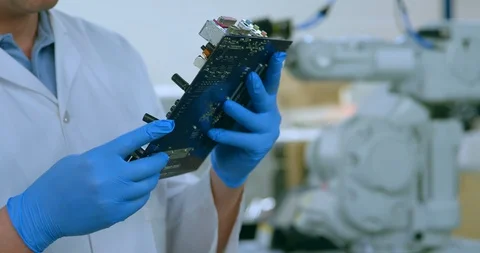 Mid section of robotic engineer examine circuit board 4k Stock Footage 99843842