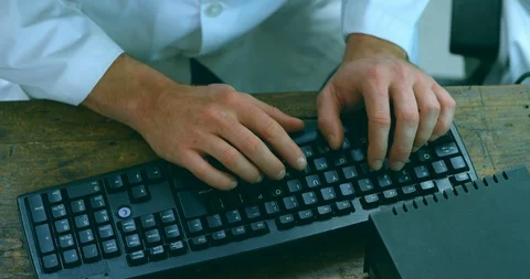Mid section of robotic engineer using desktop pc at desk 4k Stock Footage 99844278