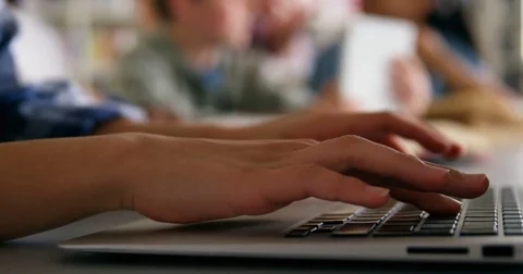 Mid section schoolkid using laptop 4k Stock Footage 82228475