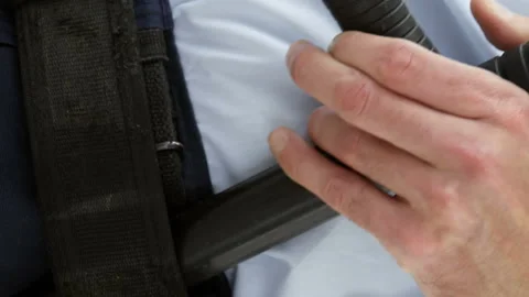 Mid section of security guard holding baton and walkie talkie Stock Footage 301361775